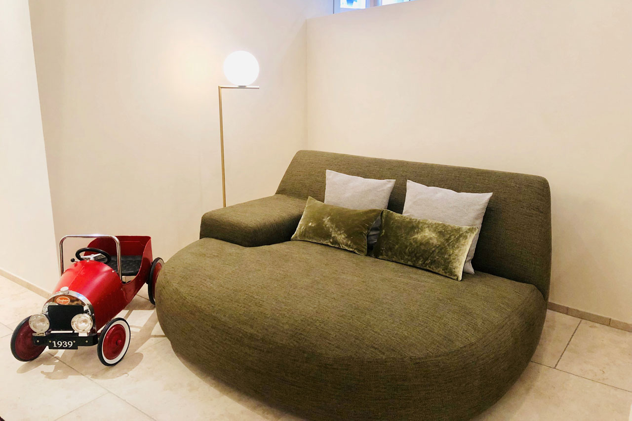 Sofa in TV room in Villa Grialetsch, Klosters