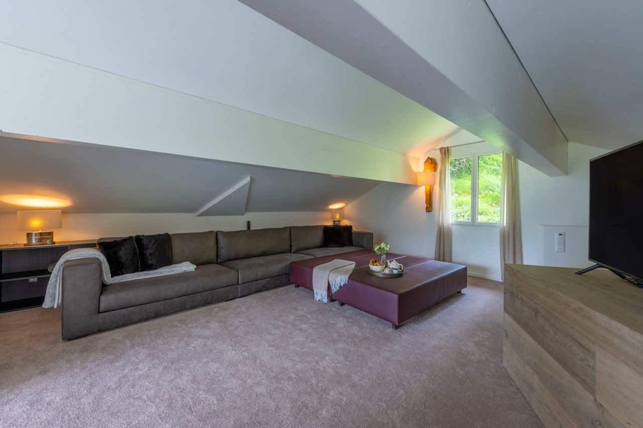 Sofas in TV room at Chalet Seehorn in Davos